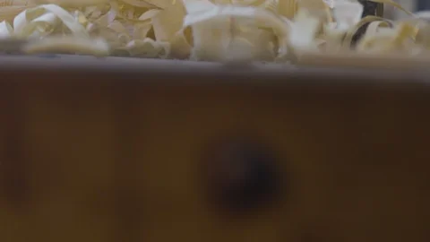 Man is peeling wood in workshop 動画素材 98046860