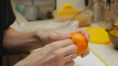Man Peels Eats Mandarin Stock Footage 147954686