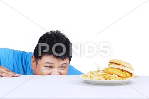 Man is peeping hamburger Stock Photos