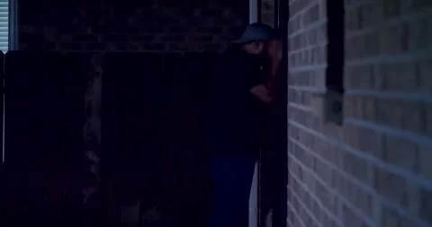 MAN PEEPING THROUGH WINDOW 1 of 7 库存影片 283783069