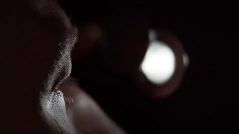 Man peeps through a peephole, macro shot Stock Footage 131740086