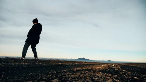 Man pees in the mountains Stock Footage 102613882