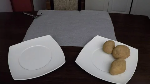 Man peling potatoes Stock Footage 70208156