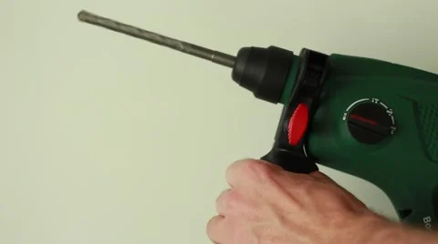 Man with perforator on white background Stock Footage 65370984