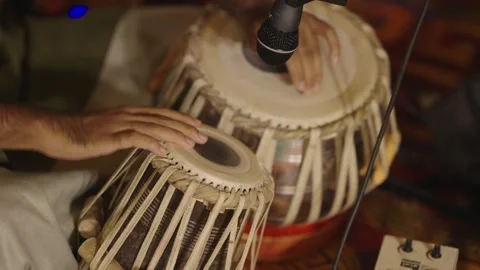Man performing and playing with Indian traditional musical instrument "Tabla" Stock Footage 337739678