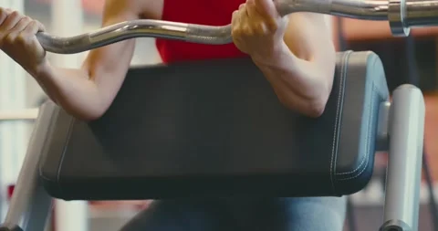 Man Performing Bicep Curls at Gym Stock Footage 323725241
