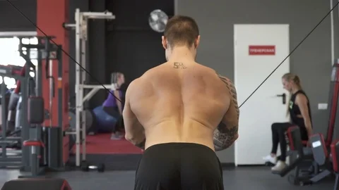 Man performing biceps exercises at the gym Stock Footage 73919691