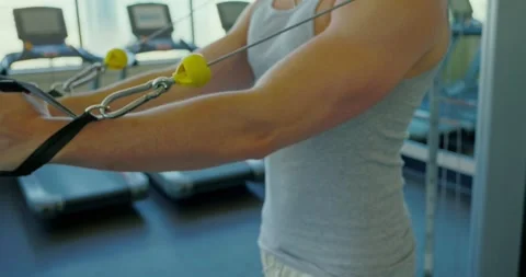 Man Performing Cable Chest Press in Gym 库存影片 323776579