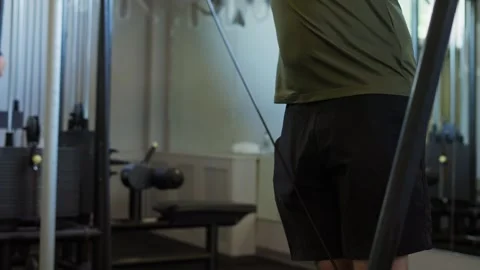 Man performing cable crossover exercise in a modern gym for fitness and strength Stock-Footage 339598104