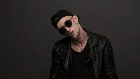 Man performing cool dance. Stylish man in glasses emotionally dancing Stock Footage 116376673