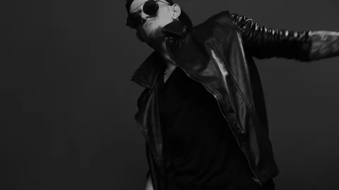 Man performing cool dance. Stylish man in glasses emotionally dancing Stock Footage 116377708