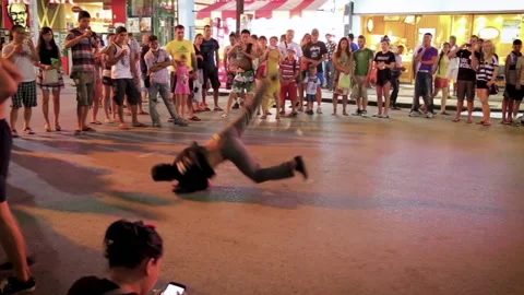 Man performing dangerous dance moves on Bangla Road. Stock Footage 130955600
