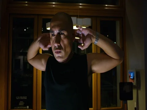 Man performing exercise at home Stock Footage 83185473