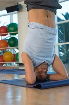Man Performing Head Stand Stock Photos