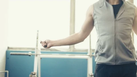 Man performing jump rope exercises at indoor gym. Stock Footage 72030520
