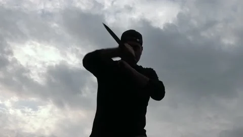 Man performing knife attacks like a professional assassin. 4K video of a killer  Stock-Footage 155156365