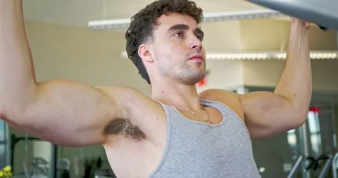 Man Performing Lat Pulldown Exercise at Gym 스톡 동영상 323776757