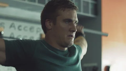 Man performing overhead lifting exercise at gym for strength training Stock Footage 312714434