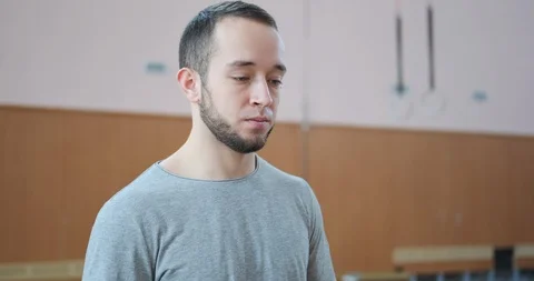 Man performing planche on parallel bars Stock Footage 104992123