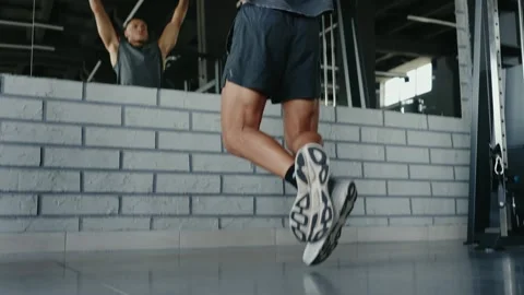 Man Performing Pull-Ups in Gym for Strength Training and Fitness Stock Footage 282093884