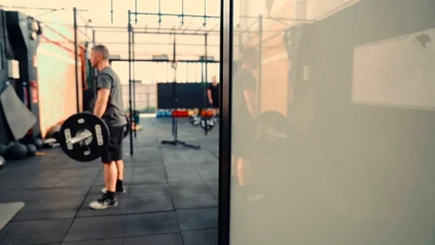 Man performing pull ups with heavy weights. Fitness exercise. Stock Footage 94428342