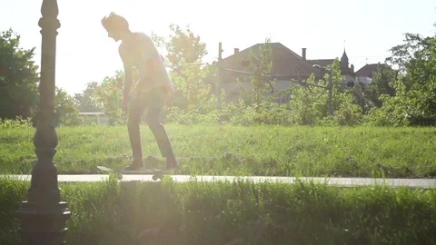Man performing skating trick at park in slow motion Stock Footage 71558468