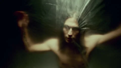 Man PerformIng Slow Graceful Dance behind Translucent Plastic Curtain Stock Footage 289829783