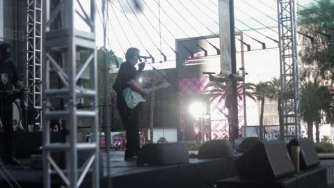 Man performing on stage with a guitar. Stock Footage 135798410