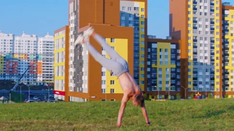 A man performs acrobatic elements Stock Footage 144284137