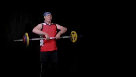 A man performs a barbell upright rowing.Fast speed. Stock Footage 133157427