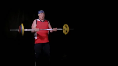 A man performs a Bicep curls with a barbell.Floor phase. Stock Footage 133157428