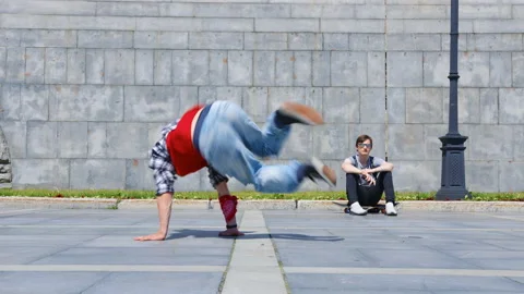 A man performs breakdance in the city street Video stock 144485529