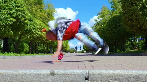 A man performs breakdance in the city street Video stock 146257050
