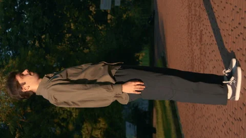 A Man Performs Choreography With His Hands At Sunrise In The Park 4k Video Stock Footage 275292248