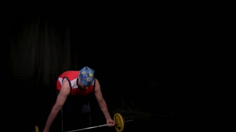 Man performs a deadlift and Bent-over rows.Wide grip. Stock Footage 134010494