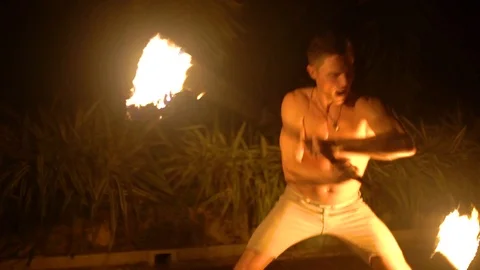A man performs a fire dance performance in Bali, Indonesia. Stock Footage 113688131