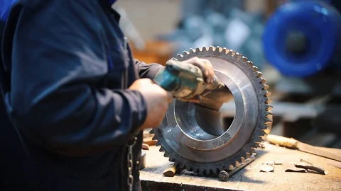 The man performs grinding work at the factory Stock Footage 110487426