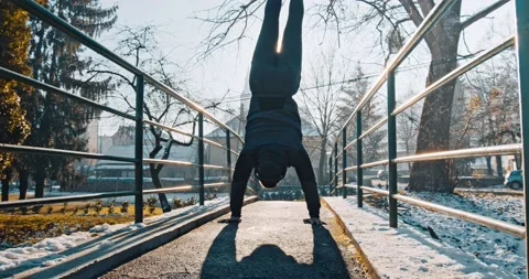Man performs handstand outdoor  Stock Footage 146555371