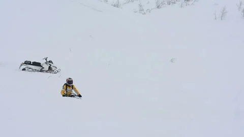 Man performs a light jump on a snowmobile Video stock 102206092