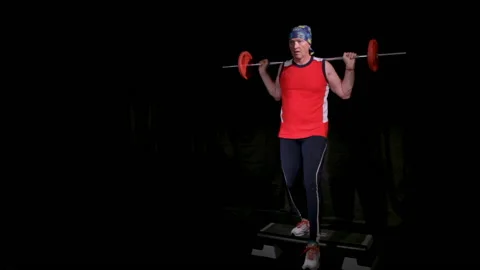 A man performs lunges with barbell.Copy space. Stock Footage 133756346