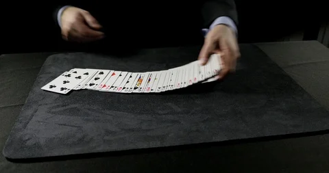 Man performs a ribbon spread on a table. Stock Footage 100786343