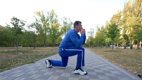 Man Performs Split Squat Jump On The Street Stock Footage 116606568