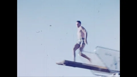 Man performs stunt dives off the diving board, Las Vegas Nevada Stock Footage 125838054