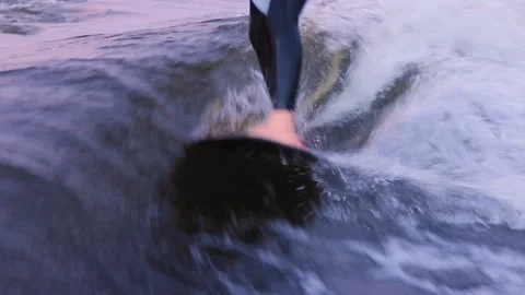 Man performs stunts wakesurfing on board among waves on sea Stock Footage 164040699