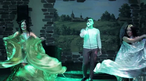 Man performs with two dancers Stock Footage 59746732