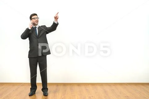 The man phone and gesture on the white wall background Stock Photos