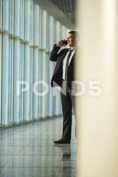The man phone in the business center hall Stock Photos