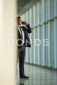 The man phone in the business center hall Stock Photos