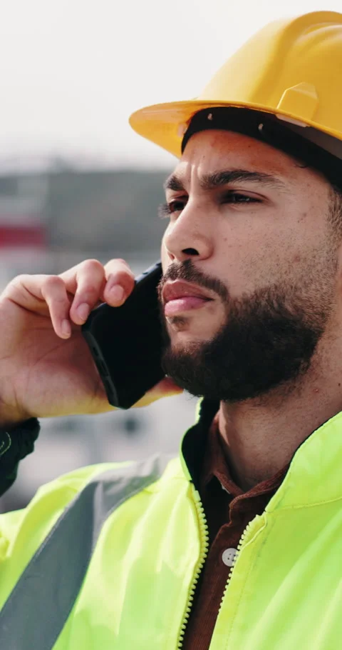 Man, phone call and engineer with stress at construction site with contact for Stock Footage 336630321