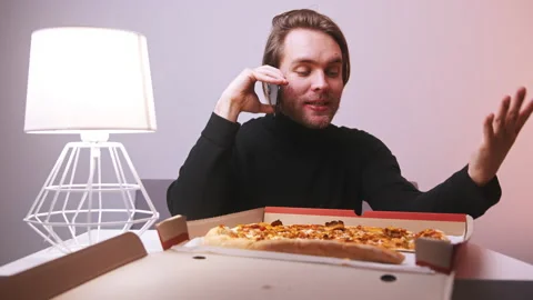 Man on the phone call complaining about pizza delivery. Throwing the slice back Video stock 147130764